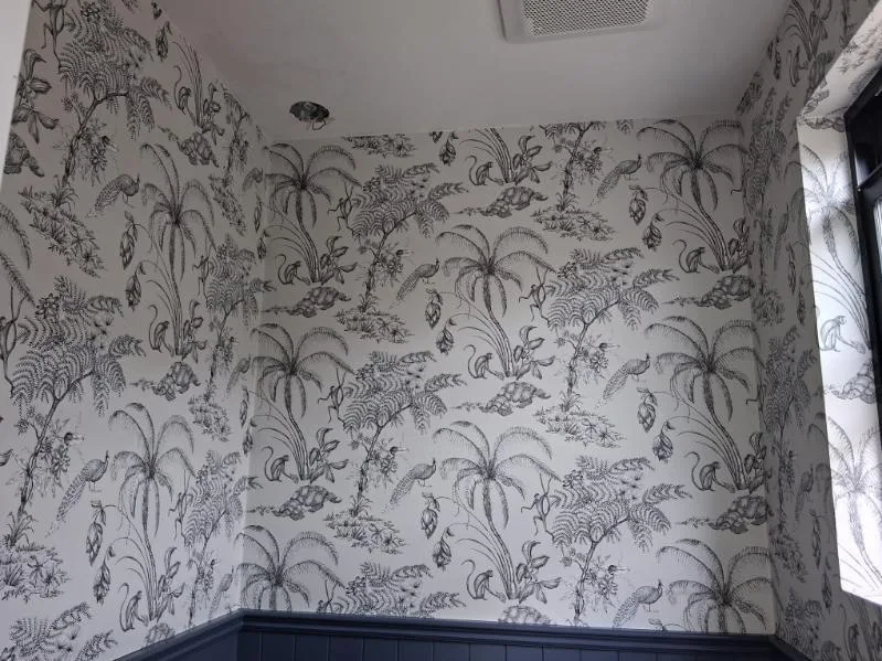 Wallpaper installer working on a project in Atlanta metro area